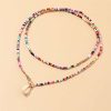 41jZHtUa3vS._SL500_.jpg MNSYD Bohême Coloré Perlé Collier Ras du Cou Plage Perles Colliers pour Femmes Adolescentes Multi Couleur Puka Shell Pendentif Perle Couches Cou Chaîne Bijoux