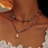 41pf7gYMNoS._SL500_.jpg MNSYD Bohême Coloré Perlé Collier Ras du Cou Plage Perles Colliers pour Femmes Adolescentes Multi Couleur Puka Shell Pendentif Perle Couches Cou Chaîne Bijoux